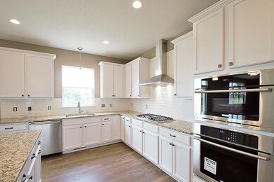 As you enter this gourmet kitchen, your eyes will 