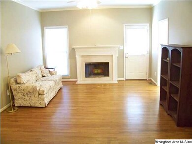 This living room has gleaming hardwoods and genero