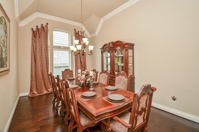 Formal dining room. Curtains stay with the home.