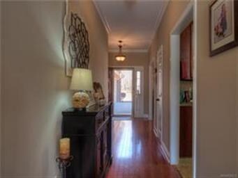 The foyer greets you with nice wood flooring, plen