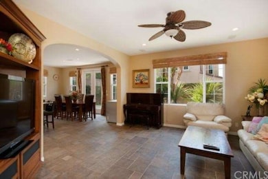 separate FAMILY ROOM with stone tile flooring, cei