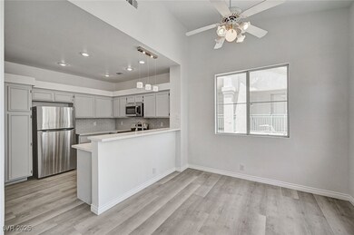 Kitchen with stainless steel appliances, light cou