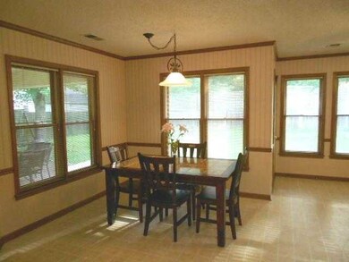 Great view of backyard and covered patio.