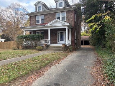 View of front of house with long driveway