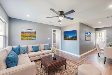 Living room with light hardwood / wood-style floor