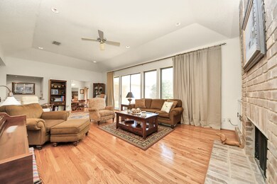 Rich wood floors gleam in the sunlight. Huge pictu
