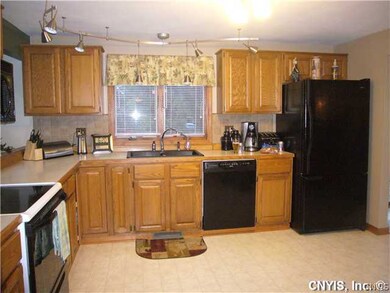 Kitchen. Updated appliances and plenty of storage - beautiful granite sink.