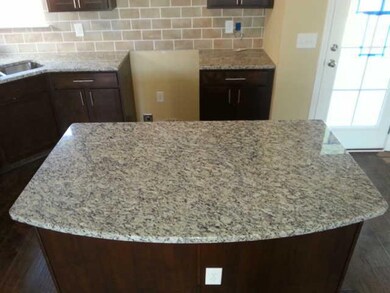 This large granite island will provide a great place to prep food for the chefs out there. 