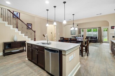 The open-concept layout seamlessly connects the ki