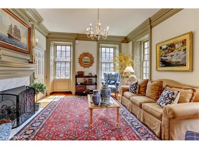Light filled formal living room with fireplace