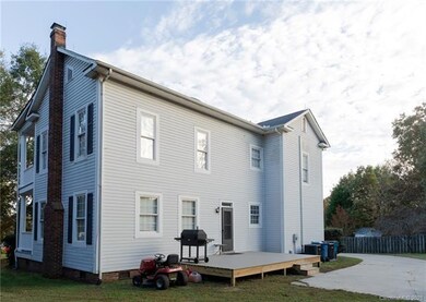 As you can see, there's a large driveway and a com