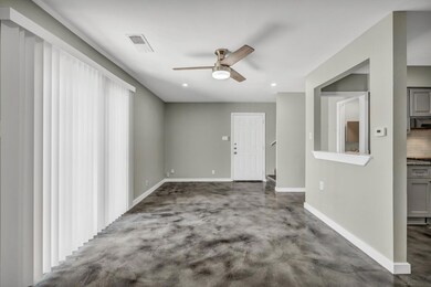 Unfurnished room featuring ceiling fan and basebo