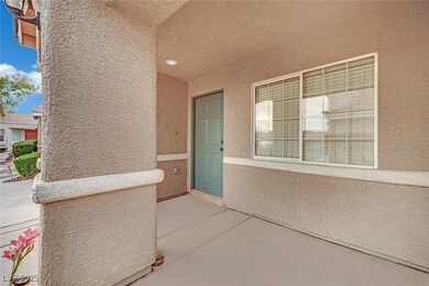 Property entrance featuring stucco siding