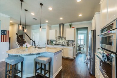 The unique half moon Kitchen Island provides addit