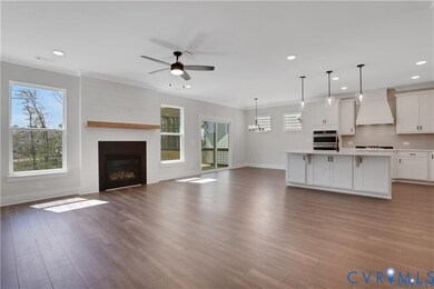 Photo represents the plan, not the actual home. Design selections may vary. A spacious family room with gas fireplace.
