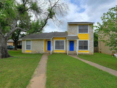 View of front of home with stone siding, a front 