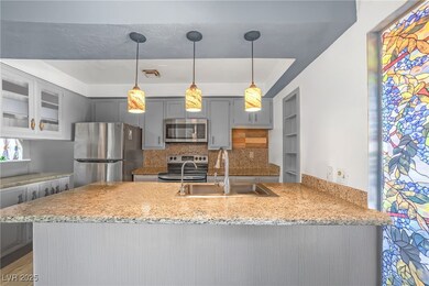 Kitchen featuring visible vents, gray cabinets, a