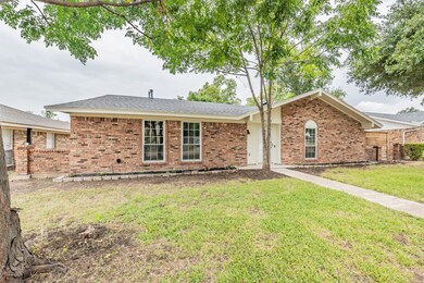 Ranch-style home featuring a front yard
