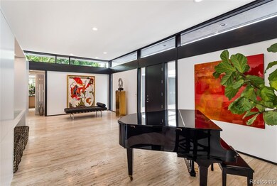 Building lobby with recessed lighting and expansive windows