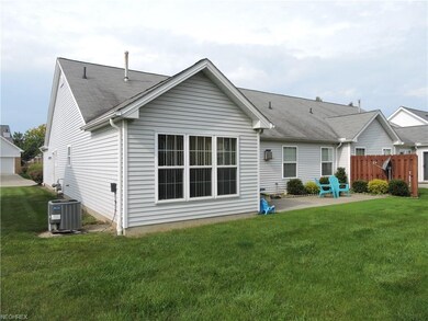 Rear of home with patio.