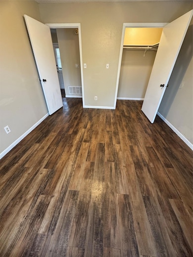 Unfurnished bedroom featuring baseboards, visible