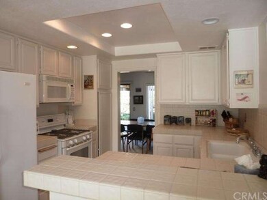 Kitchen with bar and opens to family room