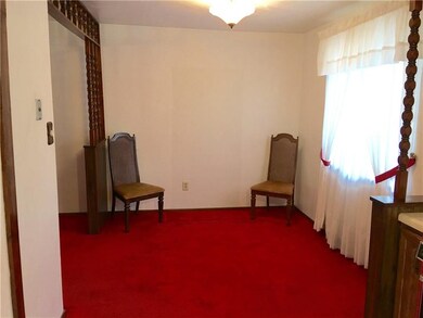 Dining room. Hardwood under carpet.