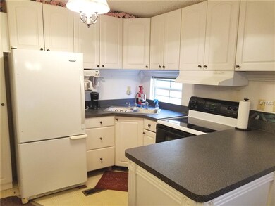 Another view of kitchen with appliances.