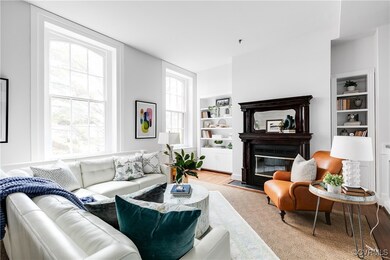 Living room with built in shelves, light wood-type