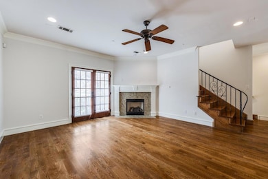 Unfurnished living room featuring visible vents, w