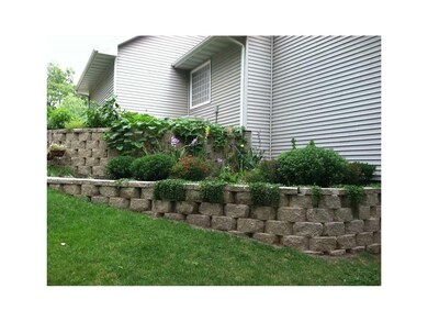 Yard. Side view of the house with extensive landsc