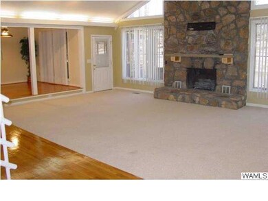 Open and spacious family room with masonry firepla