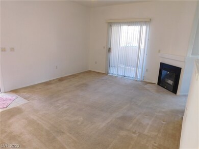 Living room with patio door and fireplace