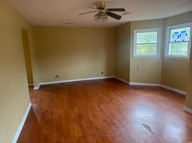 Spare room with hardwood / wood-style flooring, ar