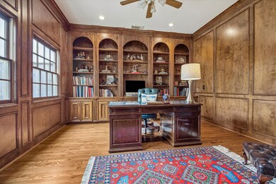 The stately first floor study overlooks the beauti