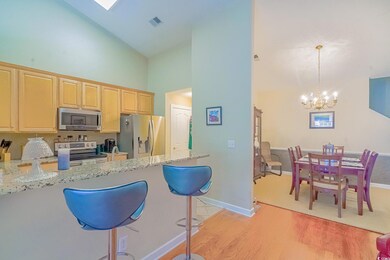 Kitchen with stainless steel appliances, light bro