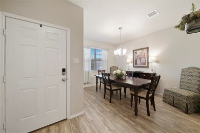 Formal dining room is near front door and has another access to kitchen.
