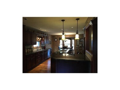 Island and a down draft gas stove top.
