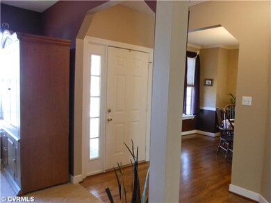 Foyer - Foyer with hardwood floors and beveled doo