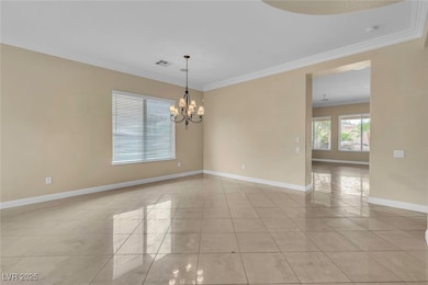 Empty room featuring light tile patterned floors,