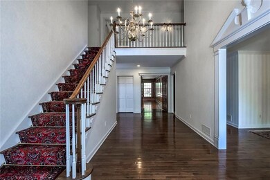 Grand 2-Story Foyer with Gleaming Hardwood Floorin