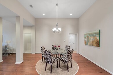 Warm wood flooring, a neutral color palette, updated chandelier and recessed lighting provide a great start for designing your elegant dining room.