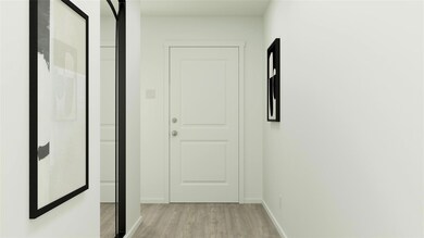 Hall featuring baseboards and light wood-style flo