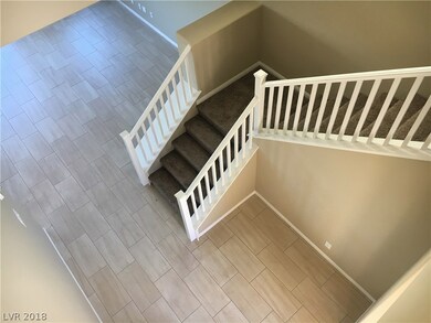 Entry Foyer (as seen at top of stairs). Vaulted ce