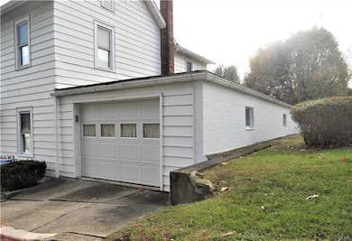 An attached 2 car tandem garage