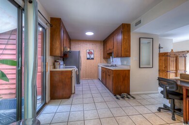Kitchen featuring sink, light tile patterned floor