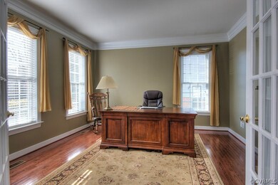 First floor Home Office with hardwood flooring and