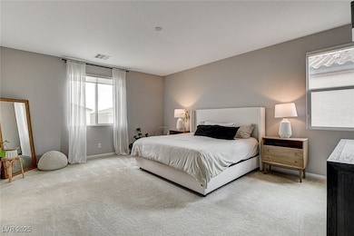 Carpeted bedroom featuring baseboards