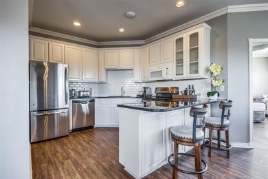 Kitchen featuring dark wood-type flooring, kitchen