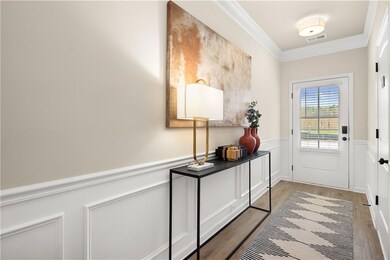 Doorway to outside featuring crown molding, visibl